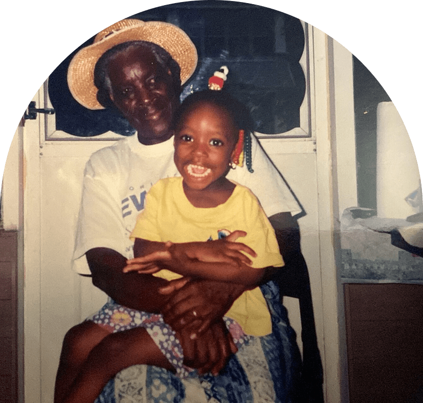 Elderly man with smiling child on lap