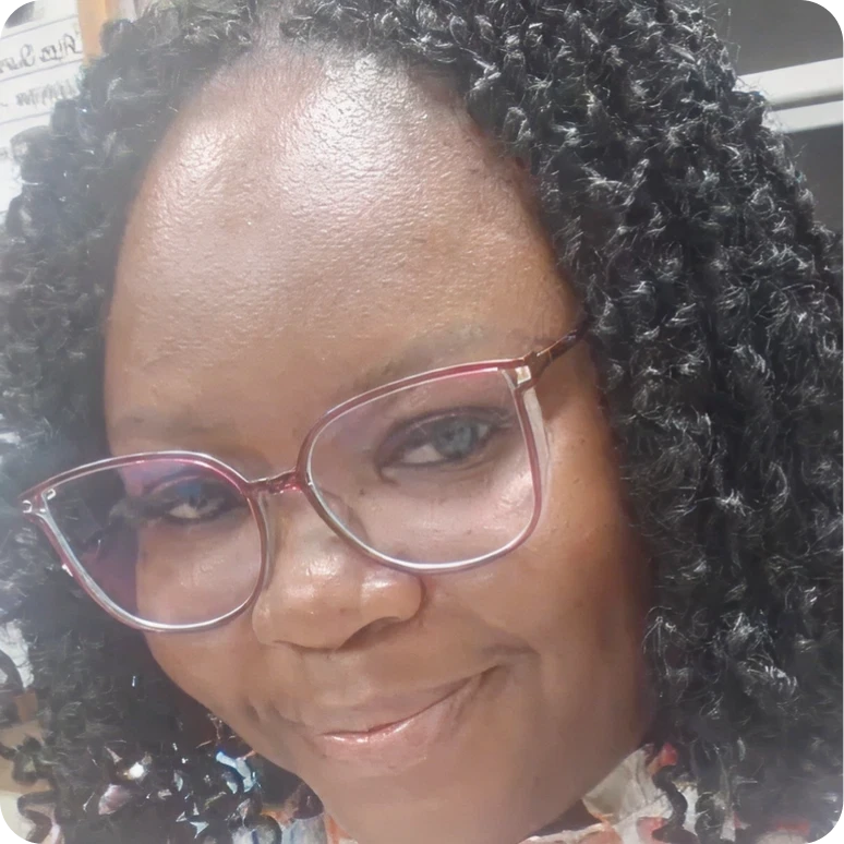 Happy woman with curly hair and glasses