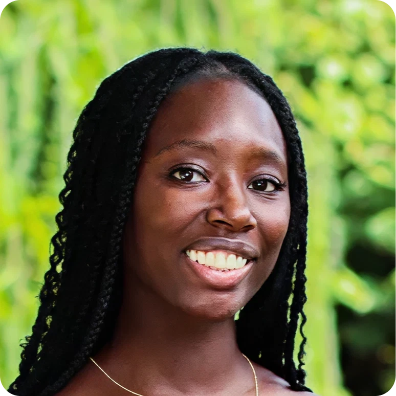 Woman in front of green background